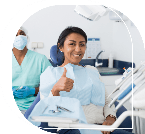 Dental patient giving a thumbs up in Wallingford dental office