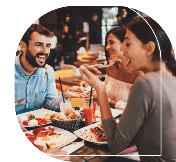 Group of adults eating at a restaurant