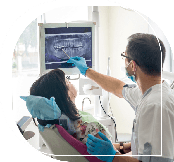 Dentist showing a patient an x ray of their teeth