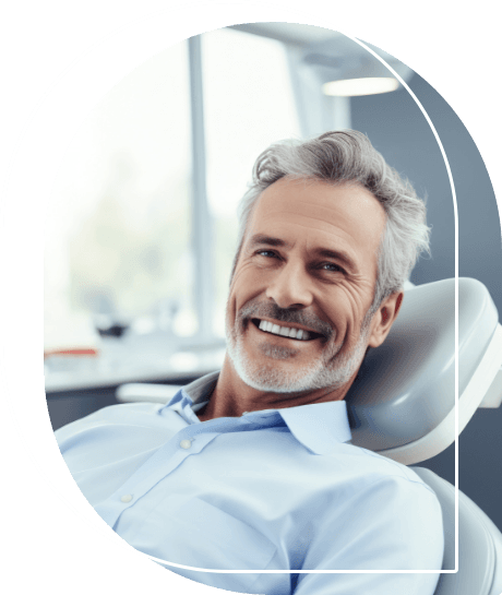 Man smiling while leaning back in dental chair