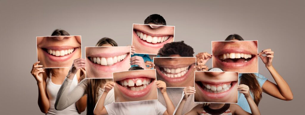 Children holding closeup pictures of their teeth.